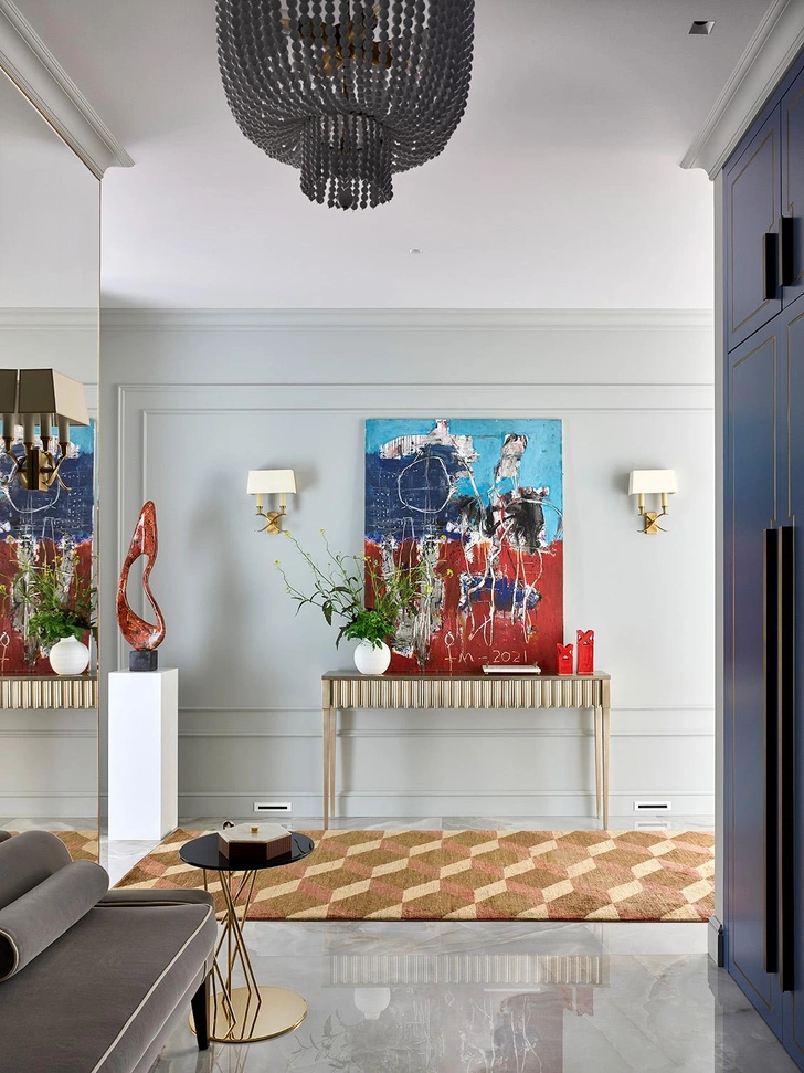 Столик-консоль, Baker Furniture. Декоративная скульптура, Лев Ефимов. Картина «Осенний ветер», Игорь Литвинов. Кофейный столик, Black Tie. Банкетка, Tosconova. | Источник: Сергей Ананьев. Стиль: Юлия Чеботарь