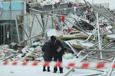 Debris, Police, and Scattered Items at Collapsed Novosibirsk Mall