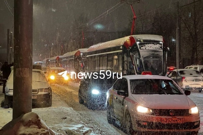 Trams queue on blocked street after warehouse fire, some since morning