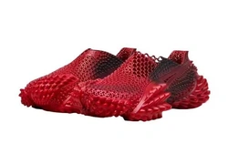 Кроссовки ASAP Rocky x Puma Monstro. Они напечатаны на 3D-принтере, похожи на лапы рептилии и доступны по цене