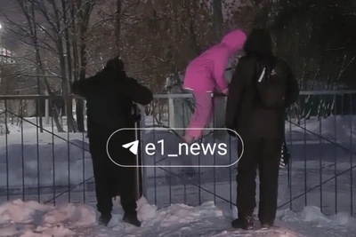 Parents in VIZ Toss Children Over Fence to Reach School