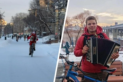 Cyclist rides no-handed playing accordion in Russia's coldest cities