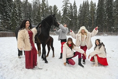 Ural Beauties in Red Pose with Horse for New Year Photo Shoot