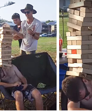 Шутники построили на голове спящего во хмелю приятеля башню из досок (видео)