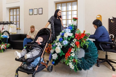 Funeral agent mothers five children, converses with deceased