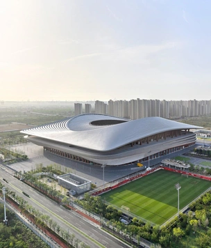 Бюро Zaha Hadid Architects завершило стадион в Сиане с крышей в форме седла