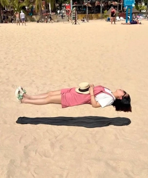 Оптическая иллюзия с парящей девушкой на пляже