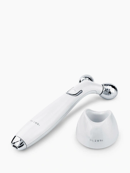 Роликовый массажер для лицаМассажер для лица E-Wave Olzori с токами EMS и нагревом массажных головок подходит для укрепляющего и расслабляющего массажа лица, шеи и области декольте с эффектом лифтинга и омолаживания кожи.Где купить: lamoda.ru