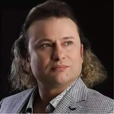 <p>Онур Акай</p>