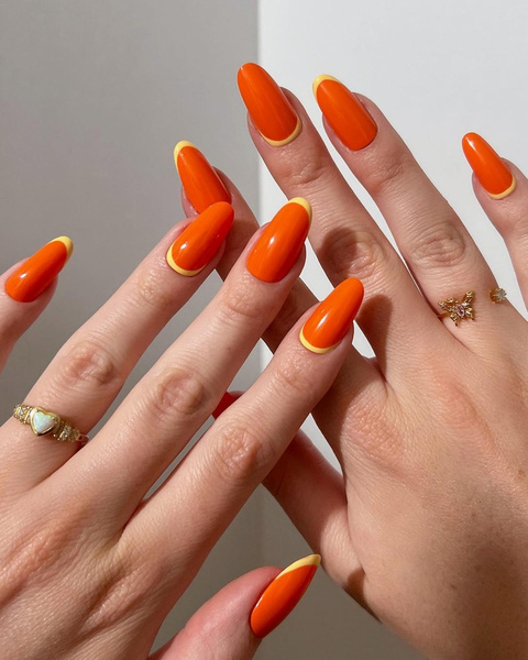 Оранжевый маникюр с желтым френчем — самый яркий дизайн ногтей на лето 2024