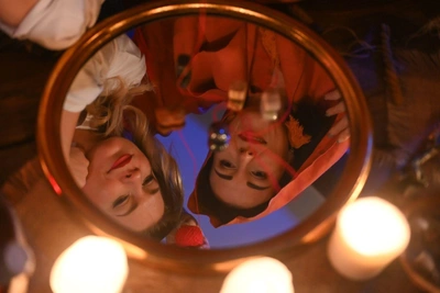 Light Candles and Peer Into Mirrors! How to Divinate on Christmas Eve