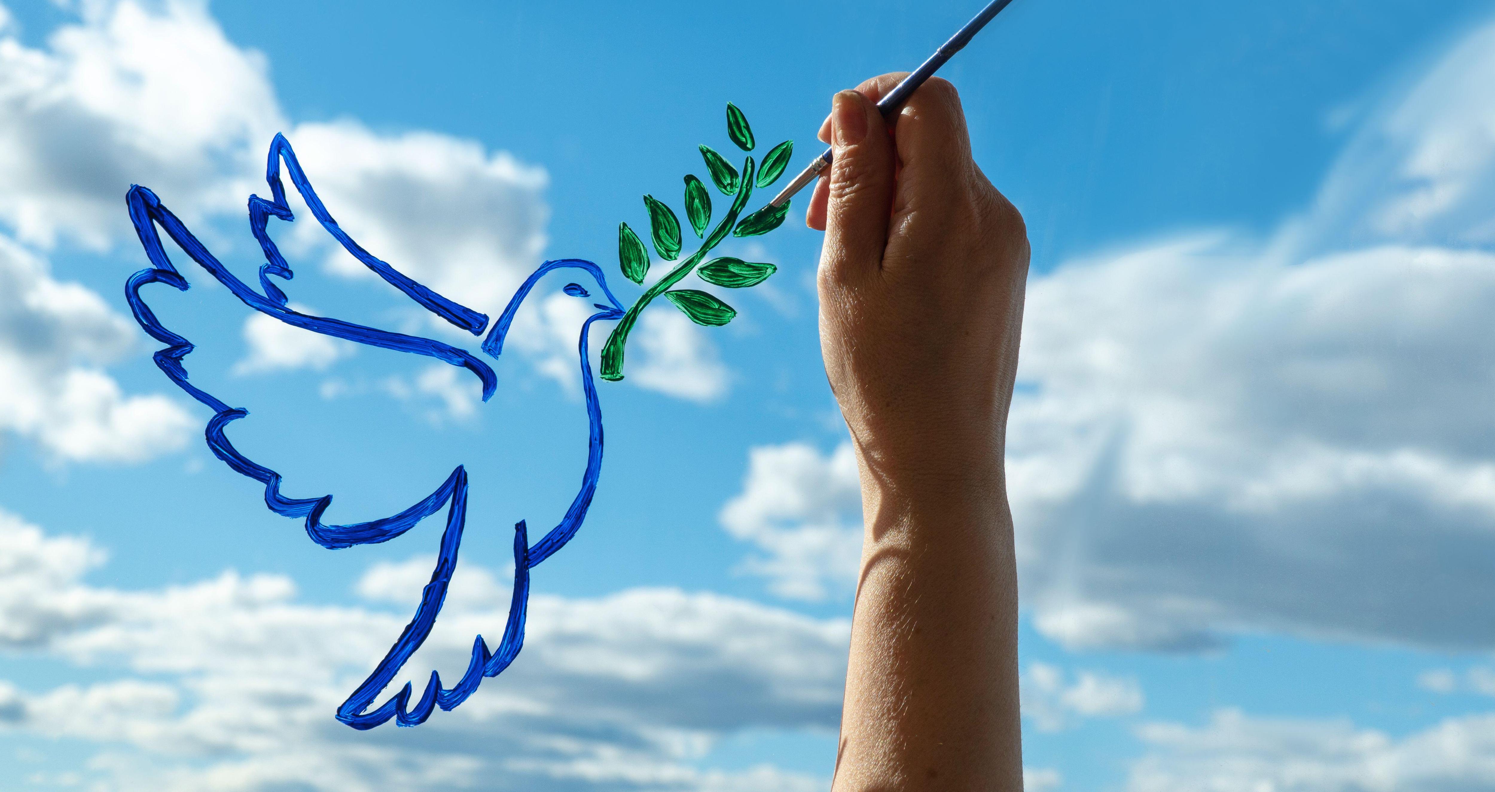 Символ мира голубь с веткой оливы