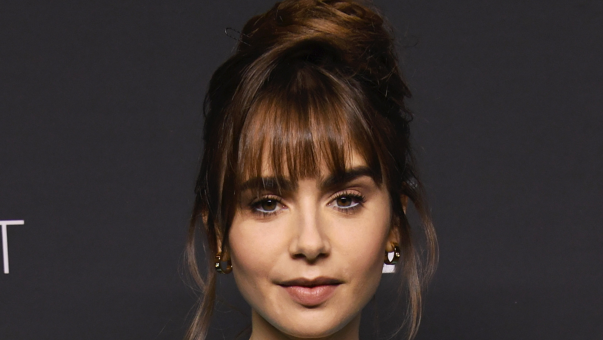 19 Celebrities With Bangs Sure To Convince You To Make