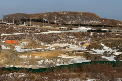 Russky Island waterpark site deserted, excavator and workers idle
