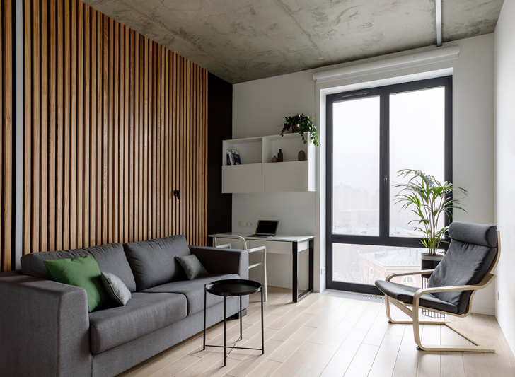 Лаконичная квартира с бетонным потолком и деревянными стенами 71 м² (фото 13)