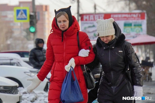 Некоторые дамы добавляют образу игривости, шапка с ушками им в этом помогает | Источник: Евгений Софийчук / NGS55.RU