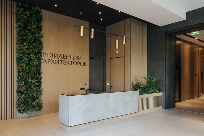 В холле, как в отеле, есть стильный ресепшен | Источник: AFI Development