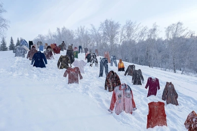 Siberian woman stages frozen clothing installation to critique overconsumption