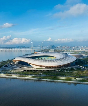 Бюро Zaha Hadid Architects достроило стадион и спортивный центр в Гуанчжоу