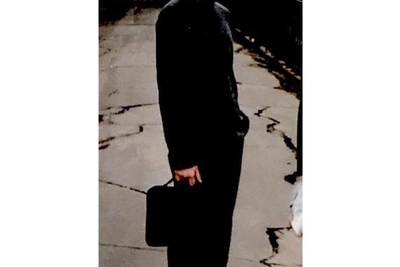 Yuri Shalabaev Shows His Student Photo