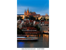 stock-photo-prague-castle-with-surrounding-buildings-across-vltava-river-in-the-evening-111873806.jpg