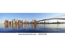 Stock-photo-brooklyn-bridge-and-manhattan-bridge-with-lower-manhattan-skyline-panorama-over-east-river-in-new-85257235.jpg