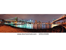 Stock-photo-new-york-city-manhattan-bridge-and-brooklyn-bridge-with-downtown-skyline-panorama-over-east-river-125115506.jpg