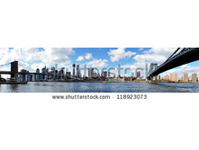 Stock-photo-panoramic-view-of-manhattan-with-brooklyn-bridge-and-manhattan-bridge-seen-from-brooklyn-bridge-118923073.jpg