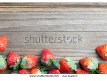 Stock-photo-fresh-strawberries-on-old-wood-247147912.jpg