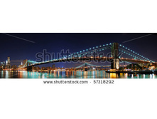 Stock-photo-new-york-city-manhattan-skyline-panorama-with-brooklyn-bridge-and-office-skyscrapers-building-in-at-57318292.jpg
