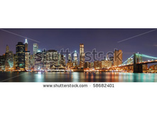 Stock-photo-new-york-city-manhattan-skyline-panorama-with-brooklyn-bridge-and-office-skyscrapers-building-in-at-58682401.jpg