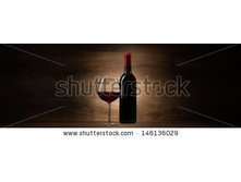 Stock-photo-green-bottle-with-red-wine-and-glass-on-a-wood-panorama-background-146136029.jpg