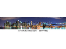 Stock-photo-new-york-city-manhattan-skyline-panorama-with-brooklyn-bridge-and-office-skyscrapers-building-in-at-56599882.jpg