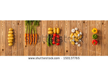 Stock-photo-vegetables-on-a-wooden-background-panorama-150137765.jpg