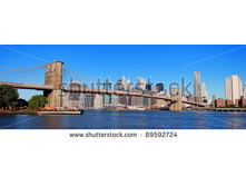 Stock-photo-new-york-city-manhattan-skyline-panorama-with-brooklyn-bridge-and-skyscrapers-over-hudson-river-in-89592724.jpg