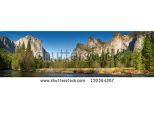 Stock-photo-yosemite-valley-panorama-showing-the-upper-yosemite-falls-and-the-bridalveil-falls-with-the-merced-139364267.jpg