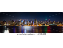 Stock-photo-new-york-skyline-panorama-by-night-taken-in-front-of-the-nd-street-canyon-empire-state-building-182631803.jpg