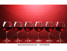 Stock-photo-wineglasses-on-red-background-107618216.jpg
