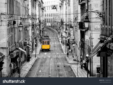 Stock-photo-famous-yellow-tram-in-the-streets-of-lisbon-capital-of-portugal-in-the-early-morning-with-no-216863326.jpg