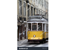 Stock-photo-lisbon-portugal-march-old-yellow-tram-on-the-street-of-lisbon-portugal-at-march-74888545.jpg