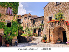stock-photo-picturesque-corner-of-a-quaint-hill-town-in-italy-148725683.jpg