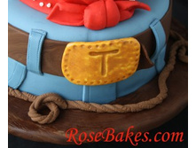 Belt-Buckle-on-Cowboy-Cake-300x247.jpg